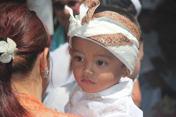 Boy in traditional Hindu dress at a fifty year festival in Blahbatuh Boy in traditional Hindu dress at a fifty year festival in Blahbatuh